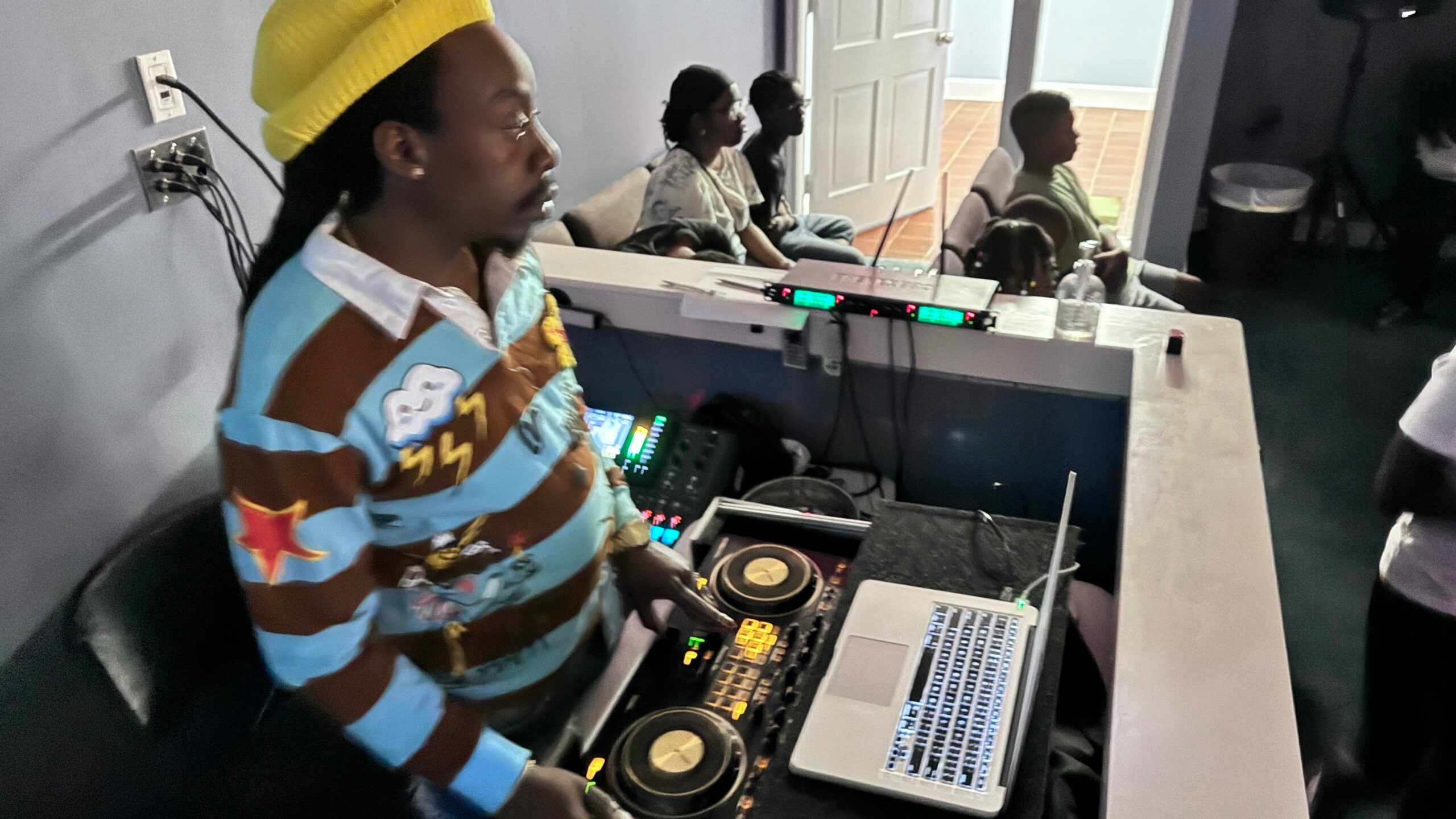 Youth operating live production cameras and audio tech boards
